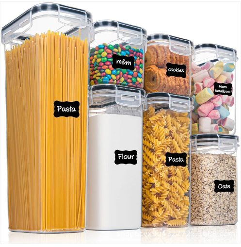 Seven airtight food storage containers with black lids holding pasta and cereals — Electromart Uganda