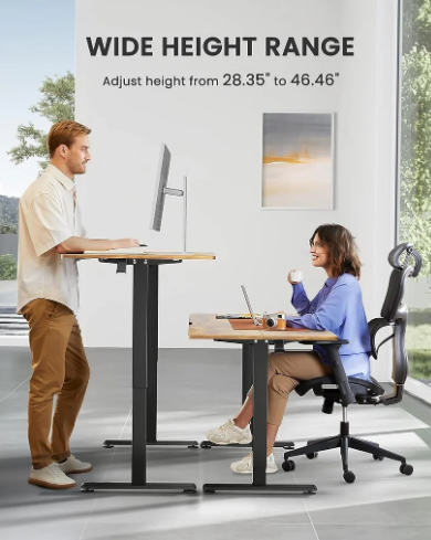 Height-adjustable standing desk with a wood top and black frame, in an office — Electromart Uganda