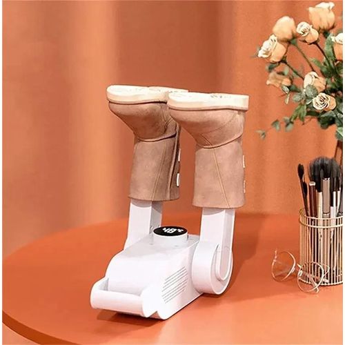 White electric shoe and boot dryer with a heat blower drying suede boots — Electromart Uganda