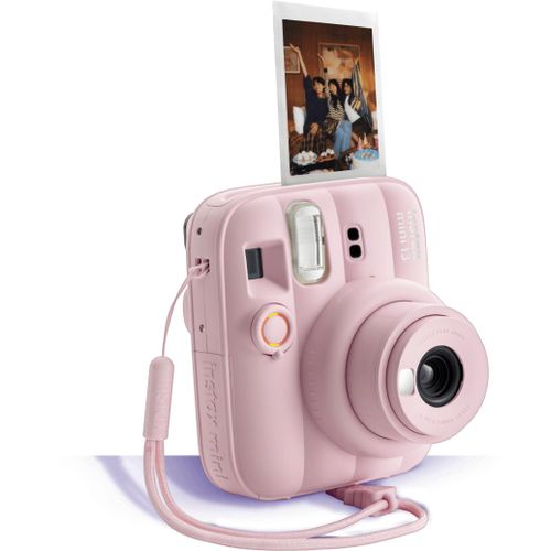 Fujifilm Instax Mini 13 instant film camera in pink with a wrist strap and a printed photo — Electromart Uganda